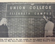 Students pointing to the Union College Elizabeth Campus sign outside the new campus in Elizabeth, New Jersey in 1970.