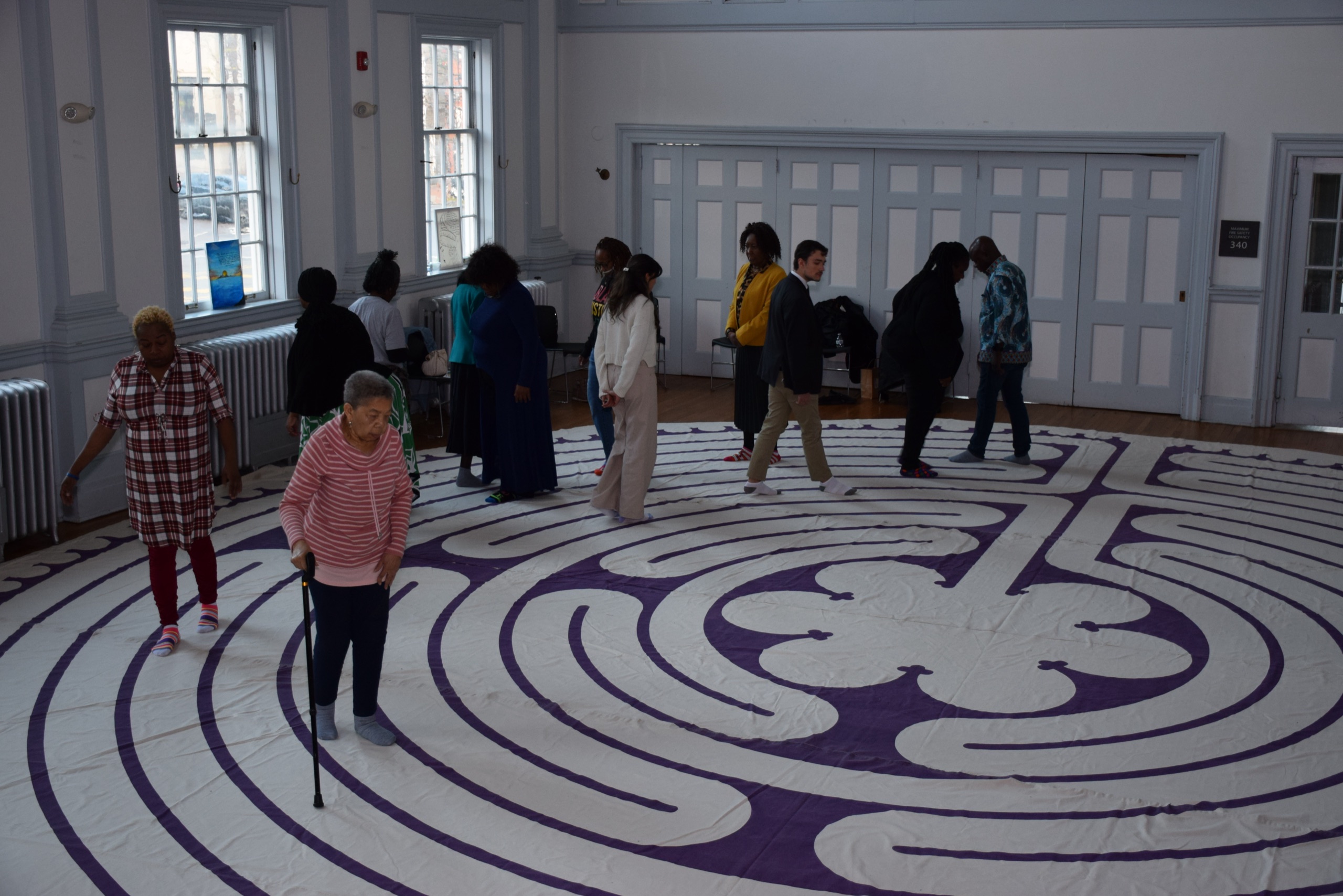 Community members experience a labyrinth-style installation at Journey to Love 2024.