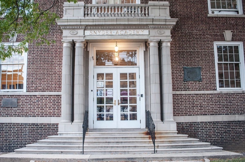 Straight-on view of the Snyder Academy entrance and columns in Elizabeth, New Jersey.